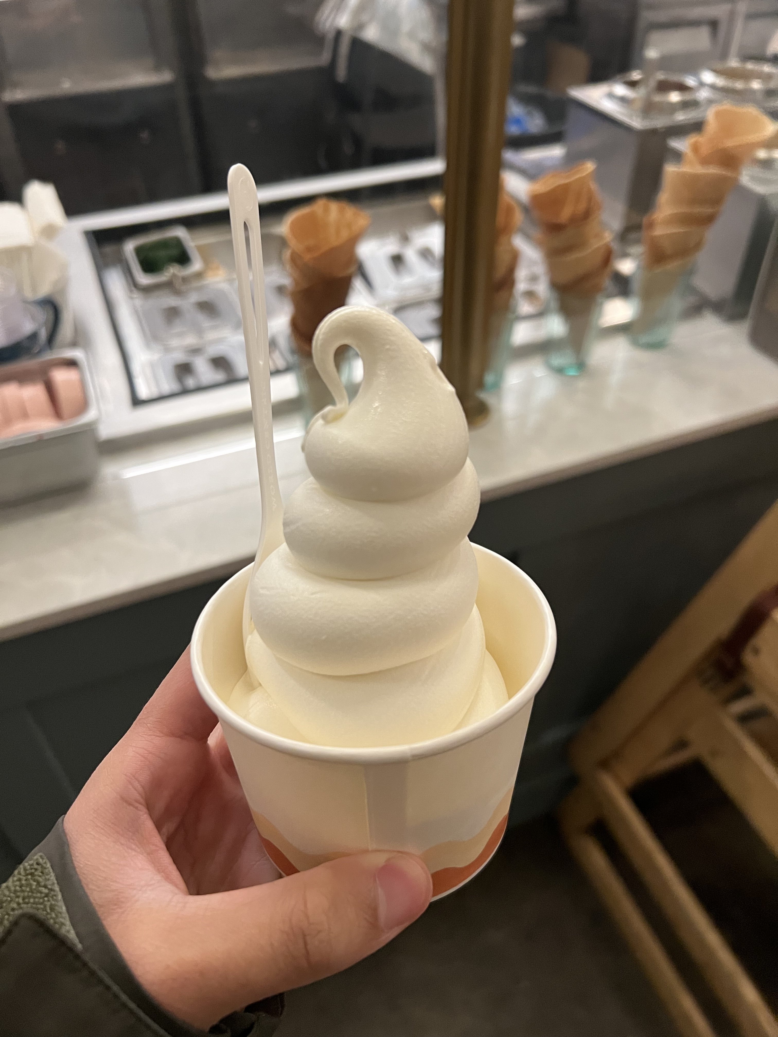 Milk Drunk's vanilla soft serve artfully curled in a cup.